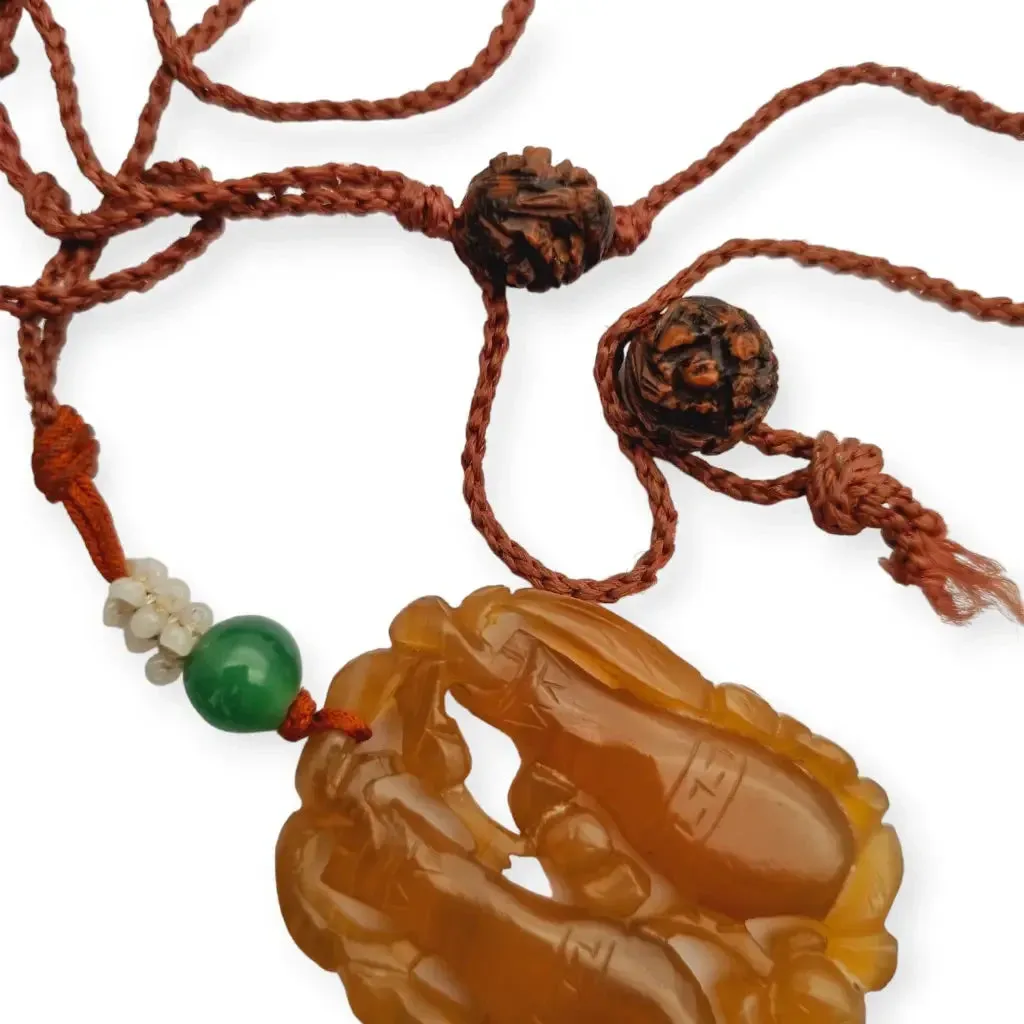 Chinese orange jadeite jade necklace with two vases, carved on both sides.