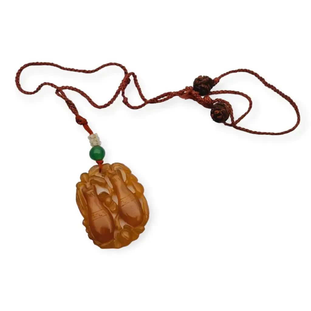 Chinese orange jadeite jade necklace with two vases, carved on both sides.
