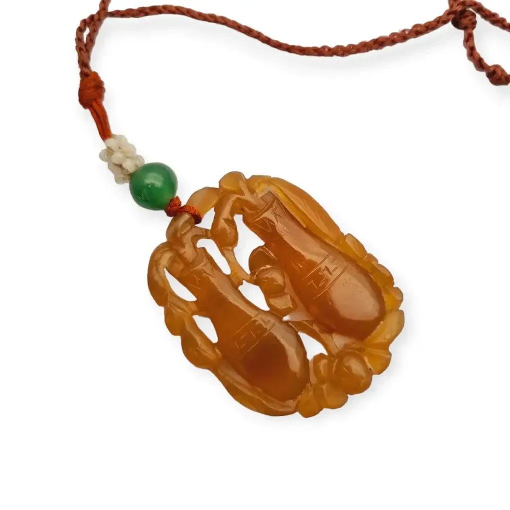 Chinese orange jadeite jade necklace with two vases, carved on both sides.