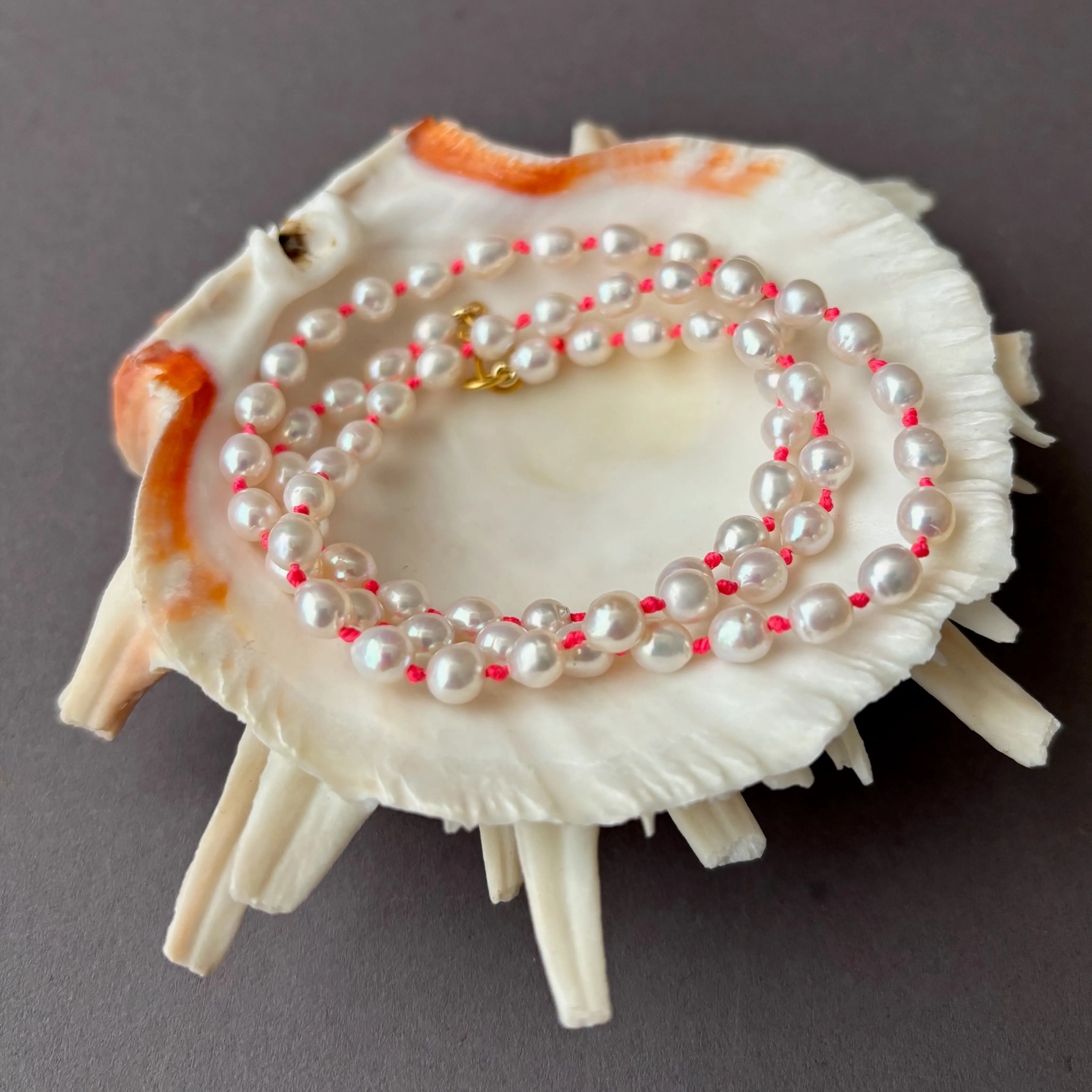 white fresh water pearls on neon knots