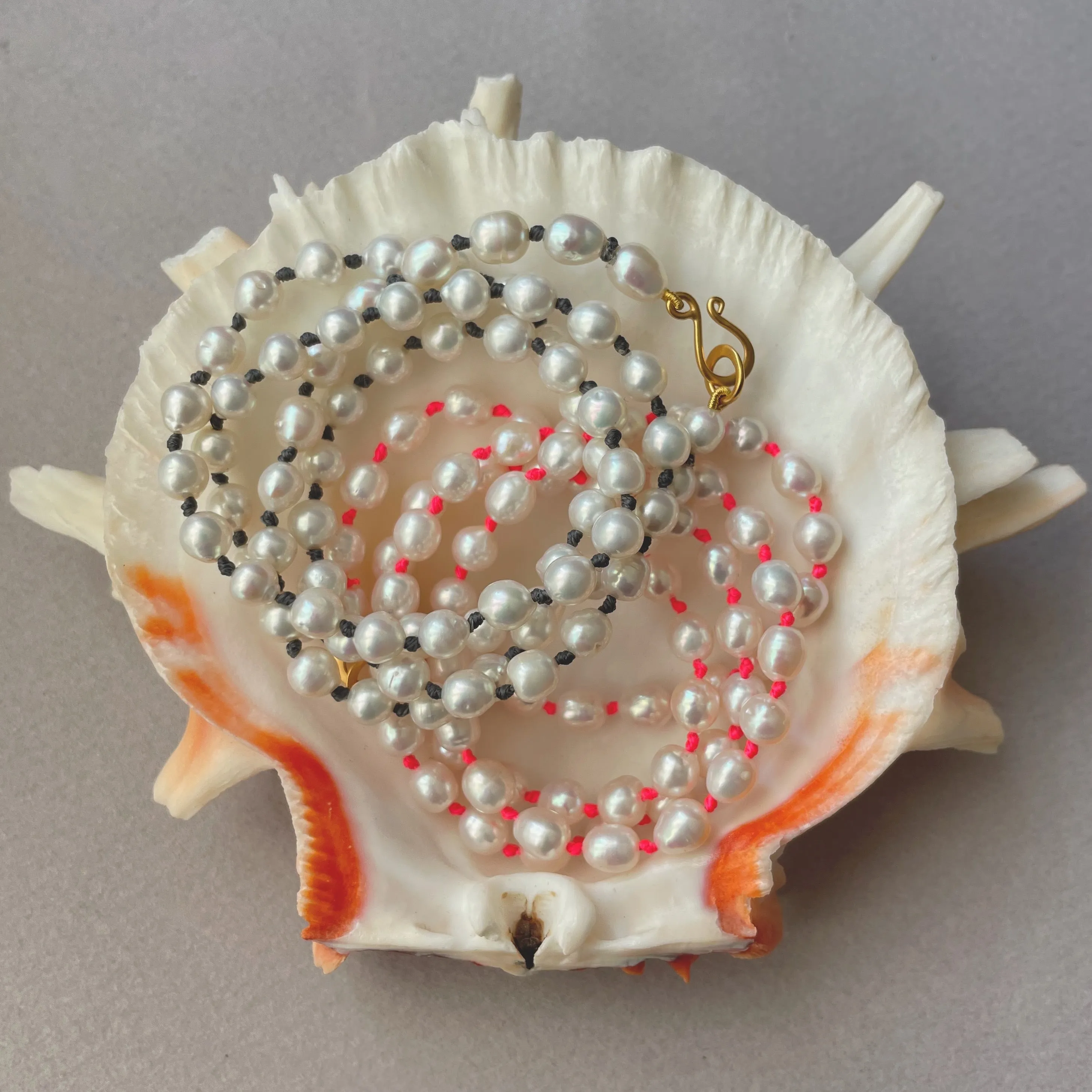 white fresh water pearls on neon knots